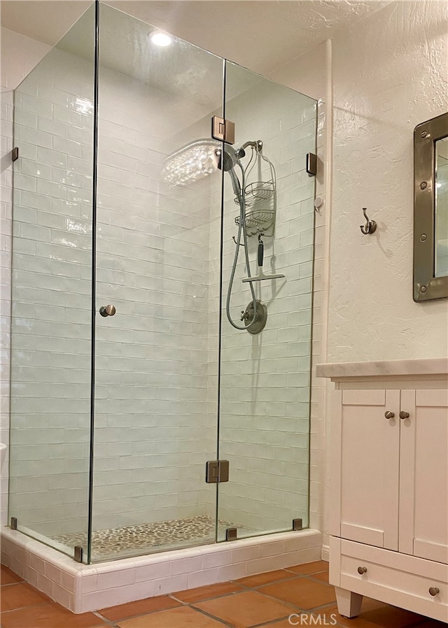 bathroom featuring tile patterned floors and an enclosed shower