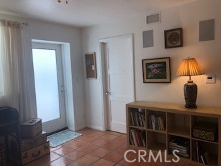 tiled entryway featuring plenty of natural light