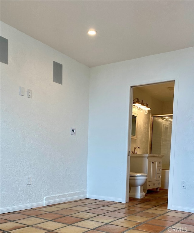 unfurnished bedroom featuring ensuite bathroom