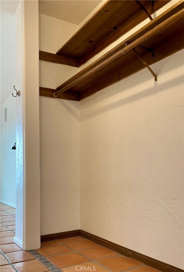 spacious closet featuring tile patterned floors