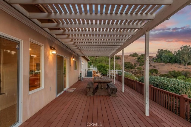 deck at dusk with a pergola