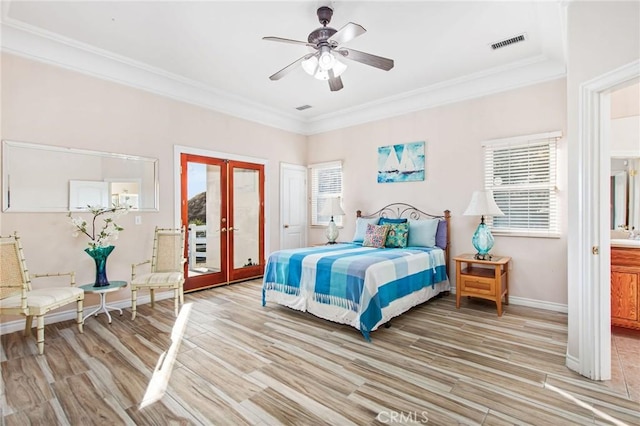 bedroom featuring french doors, light hardwood / wood-style flooring, ceiling fan, and ornamental molding