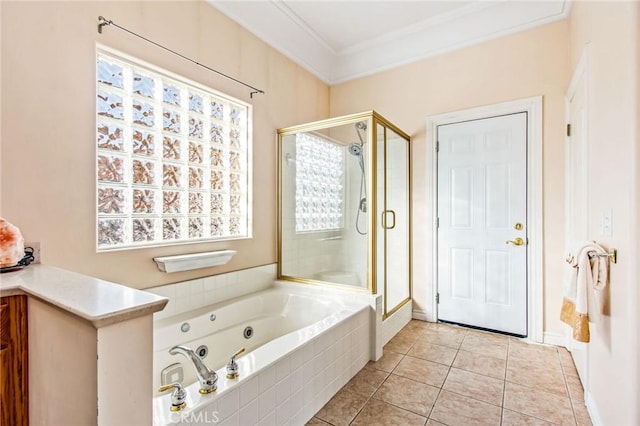 bathroom with tile patterned flooring, separate shower and tub, and ornamental molding