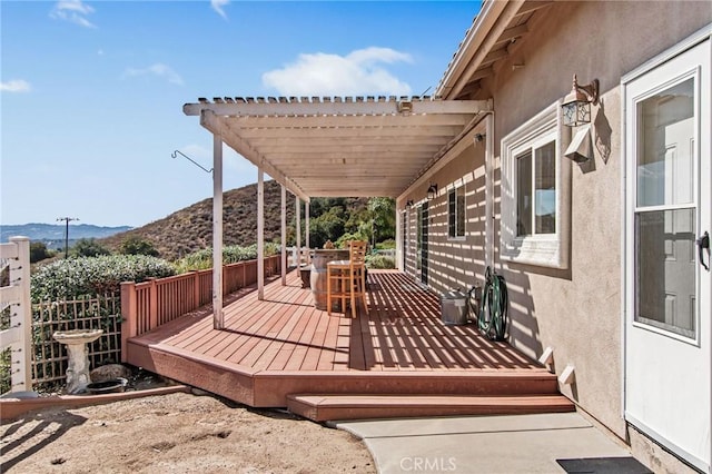 wooden deck with a mountain view