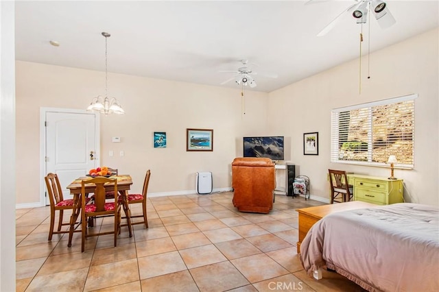 tiled bedroom with ceiling fan with notable chandelier