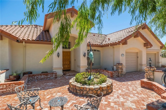 mediterranean / spanish house with a garage