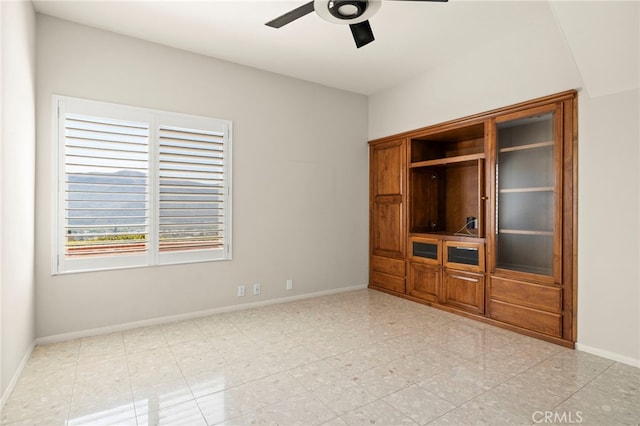 unfurnished living room featuring ceiling fan