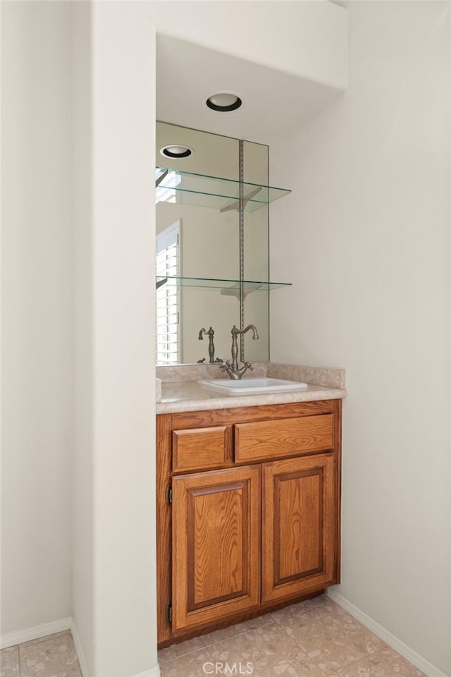 bathroom featuring tile patterned flooring and vanity