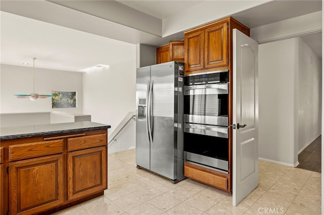 kitchen featuring appliances with stainless steel finishes and ceiling fan