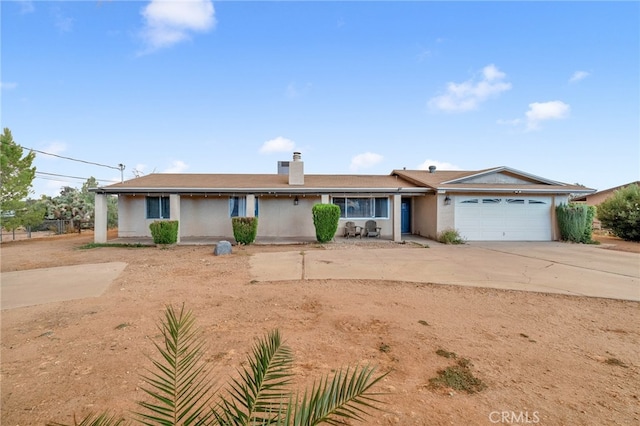 single story home featuring a garage