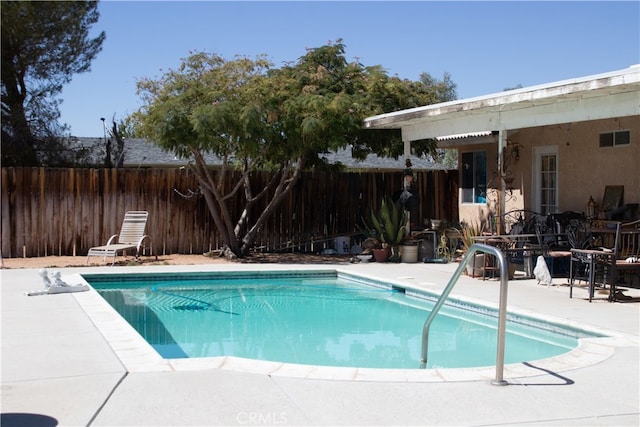 view of pool featuring a patio