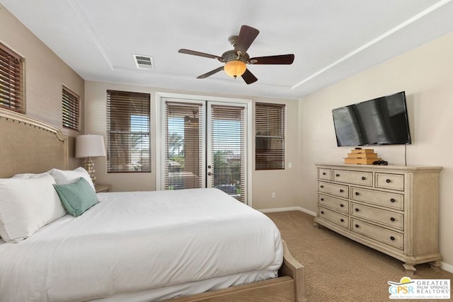 bedroom featuring light carpet, ceiling fan, and access to exterior