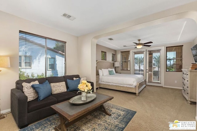 carpeted bedroom featuring ceiling fan and access to outside