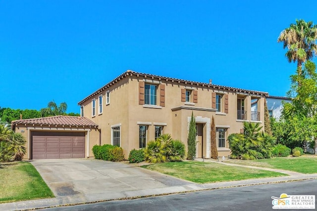 mediterranean / spanish home featuring a garage, a balcony, and a front lawn