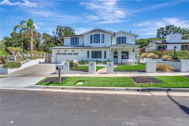 view of front of property featuring a front yard and a garage