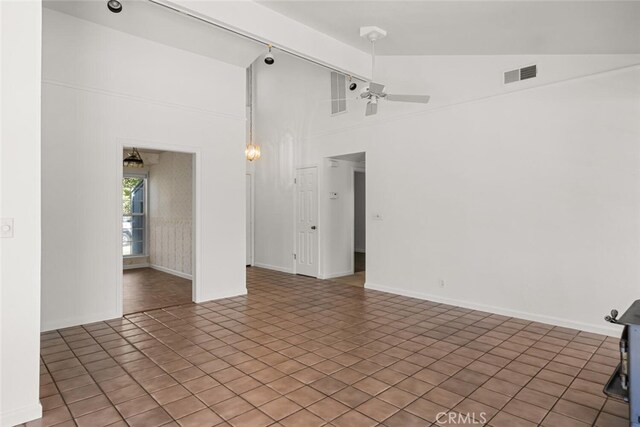 tiled empty room featuring beam ceiling, high vaulted ceiling, and ceiling fan