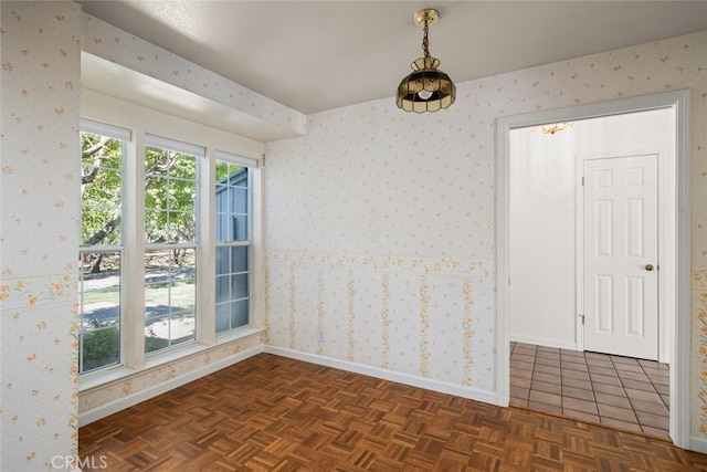 empty room with dark parquet flooring