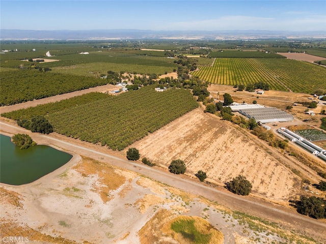 drone / aerial view featuring a rural view and a water view