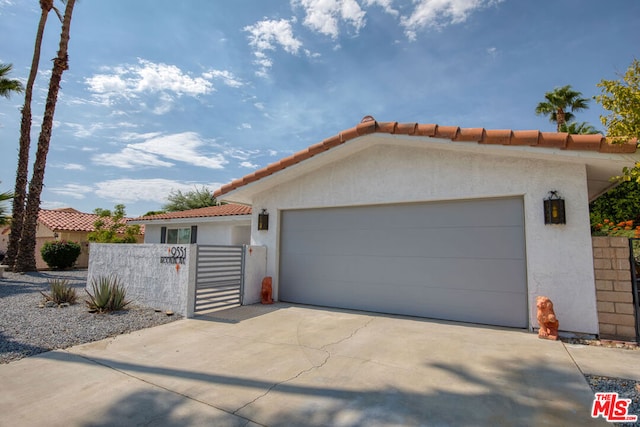 mediterranean / spanish house featuring a garage