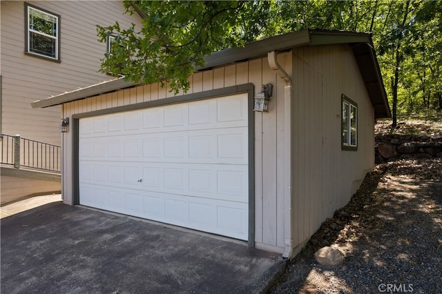 garage featuring wood walls