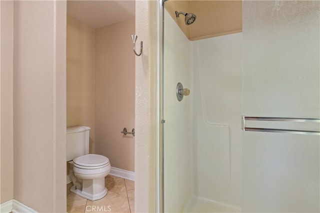 bathroom with walk in shower, toilet, and tile patterned floors