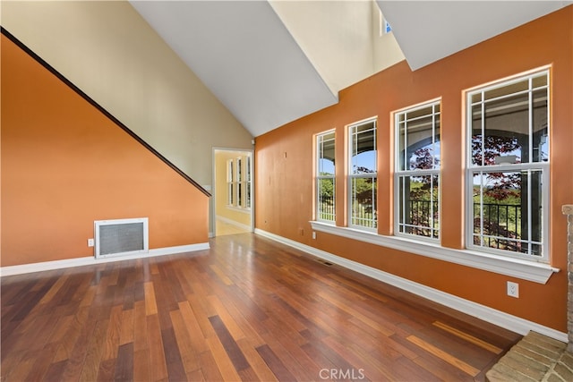 interior space with high vaulted ceiling and wood-type flooring