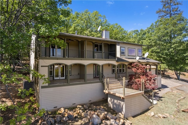 view of front of home with a balcony