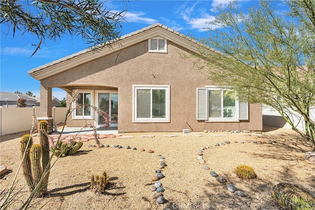 rear view of property with a patio area