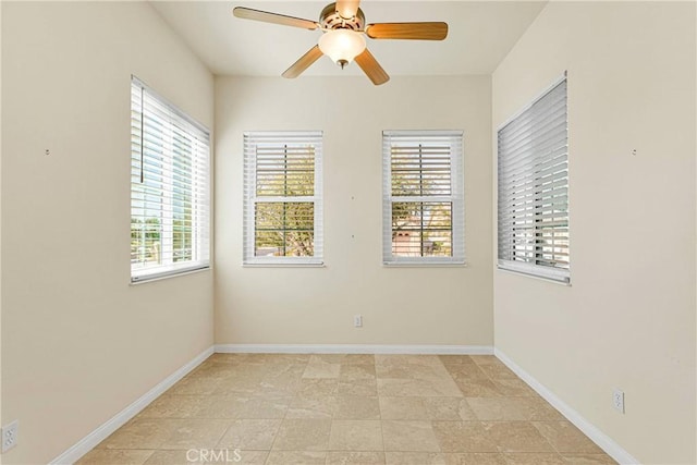 spare room with ceiling fan