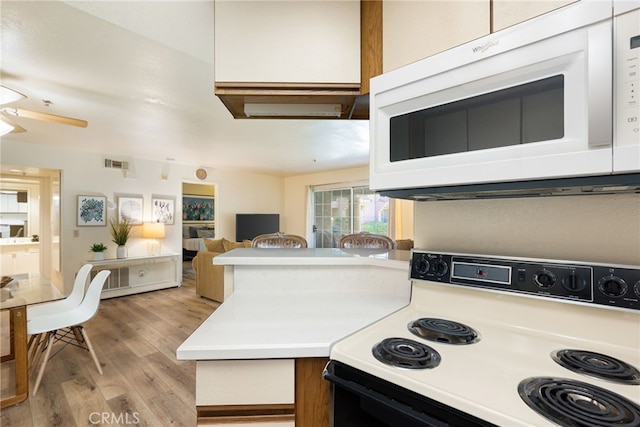 kitchen with white cabinetry, ceiling fan, light hardwood / wood-style floors, and white appliances