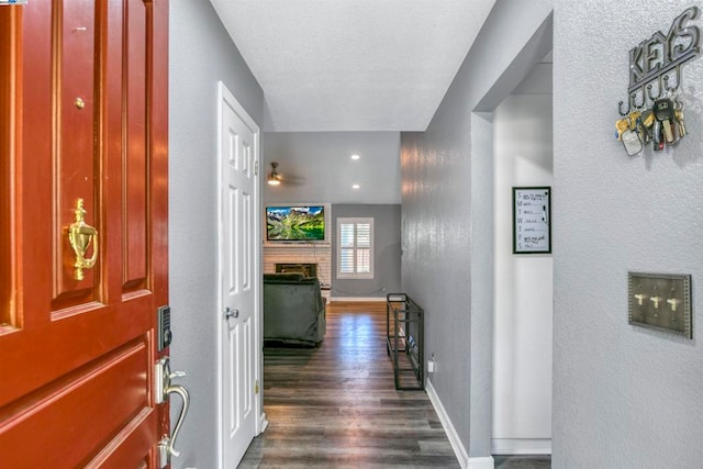 hallway with dark wood-type flooring