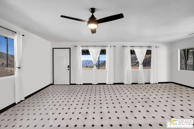 entrance foyer featuring ceiling fan