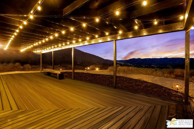 deck at dusk with a mountain view