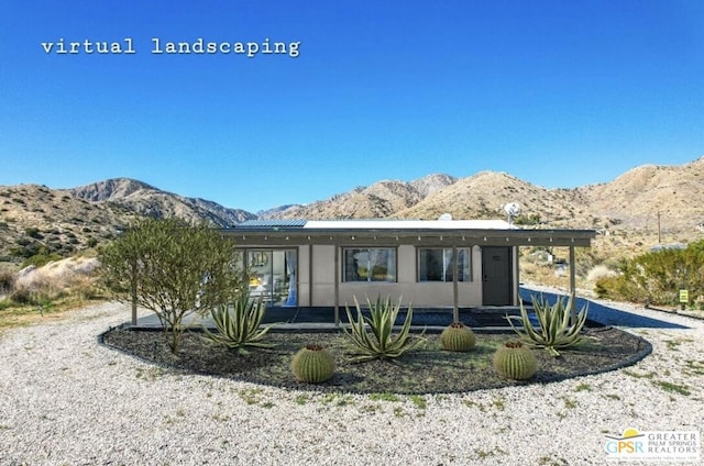 rear view of property with a mountain view