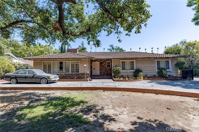 ranch-style home featuring a porch