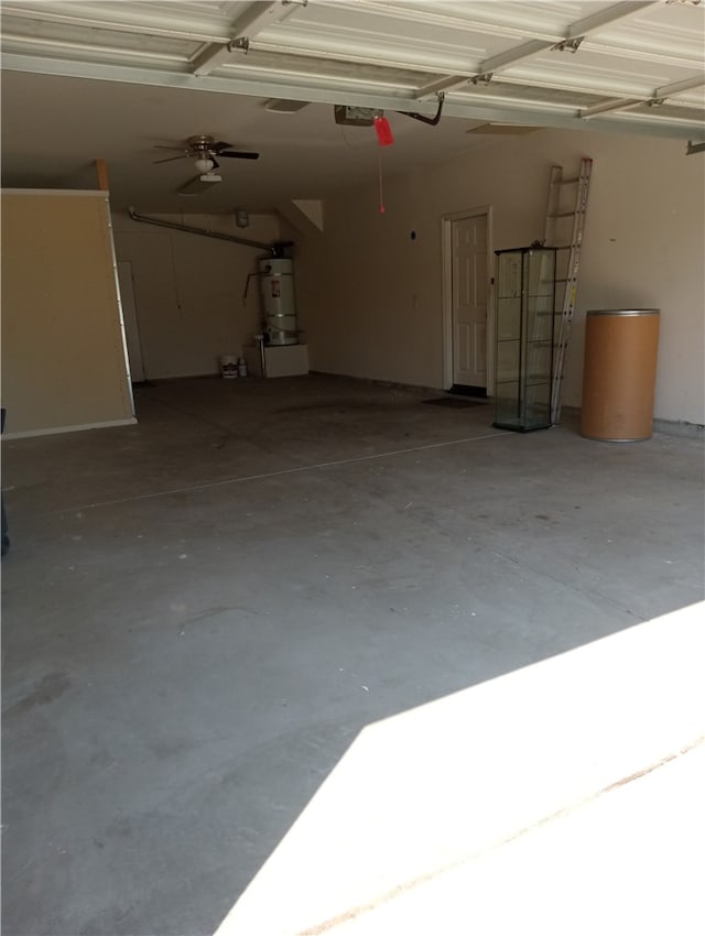 garage featuring water heater and a garage door opener