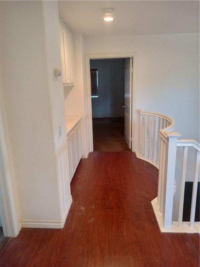 hallway featuring dark hardwood / wood-style floors