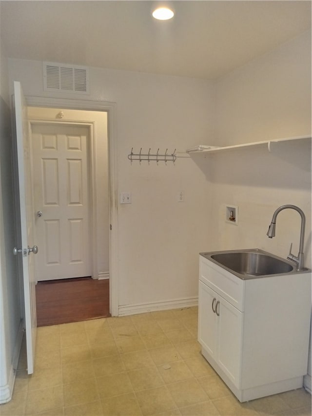 clothes washing area with washer hookup and sink