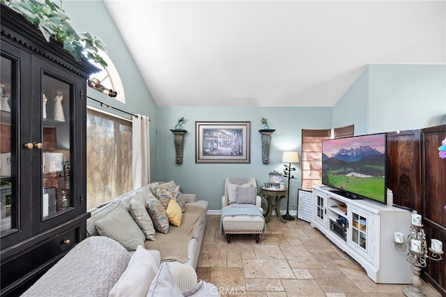 living room featuring lofted ceiling