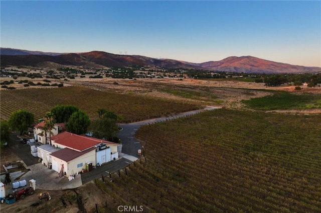 drone / aerial view featuring a mountain view and a rural view