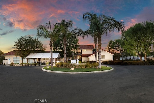 mediterranean / spanish-style house featuring aphalt driveway