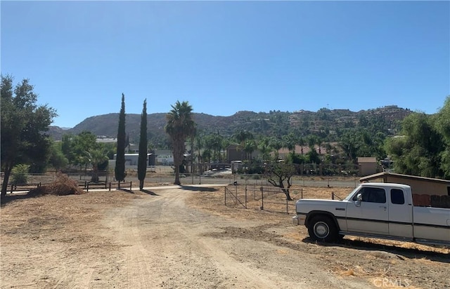 view of street with a mountain view and a rural view