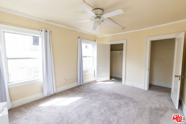 unfurnished bedroom with multiple windows, light carpet, ceiling fan, and ornamental molding