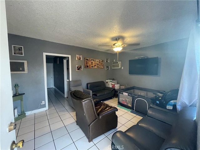 living room featuring ceiling fan, light tile patterned flooring, a textured ceiling, and a wall unit AC