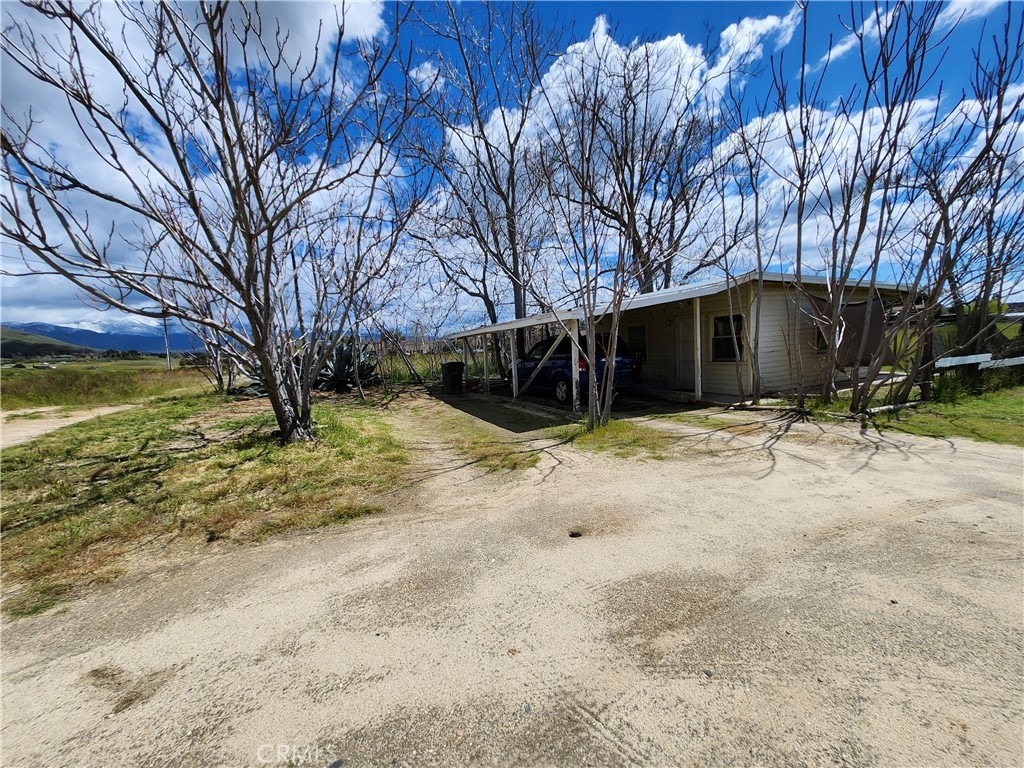 exterior space featuring a carport