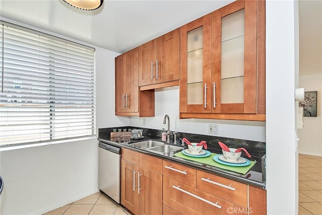 kitchen with sink, light tile patterned floors, and dishwasher