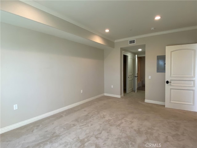 carpeted spare room with crown molding