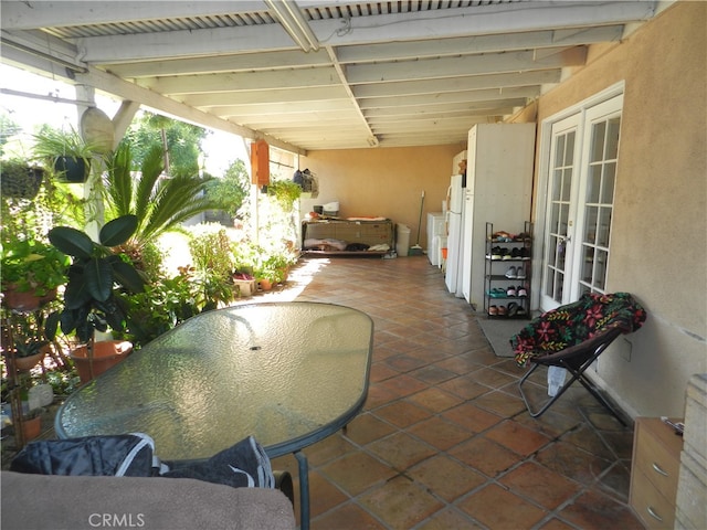 view of patio / terrace with french doors and a pergola