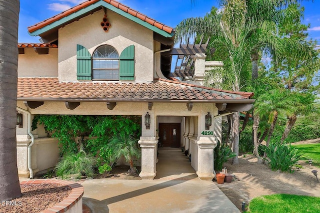 mediterranean / spanish-style house with a garage