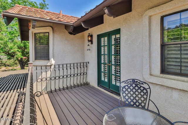 wooden deck featuring french doors